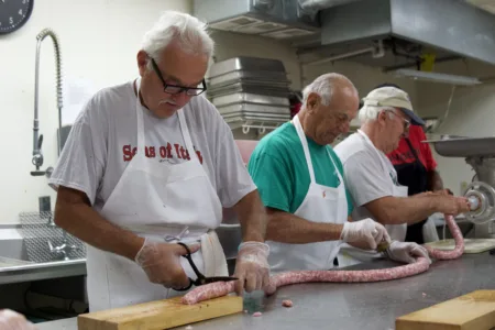 Sons and Daughters of Italy prepare its iconic sausage sandwiches for Italian Festival